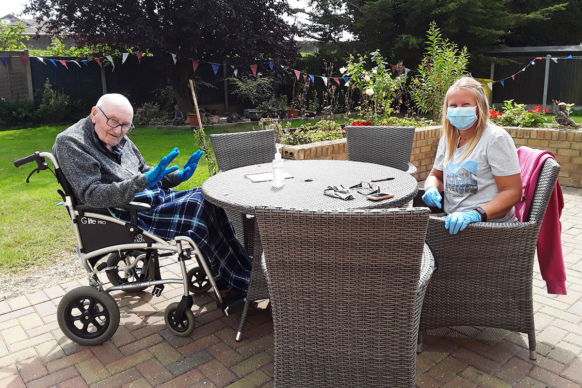 Silverpoint Court residents having a socially distance visit from a loved one