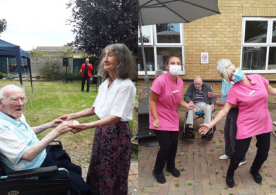 Staff and residents dancing at a BBQ party at Silverpoint Court