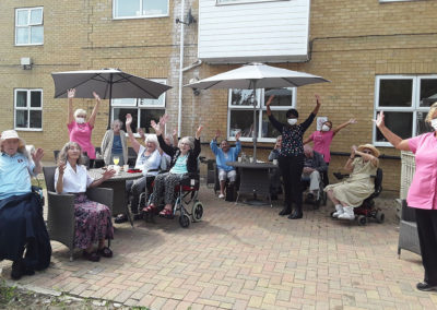 Group shot of staff and residents outside at Silverpoint Court