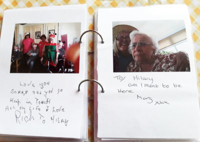 A book of farewell photos and messages for a staff member leaving Silverpoint Court