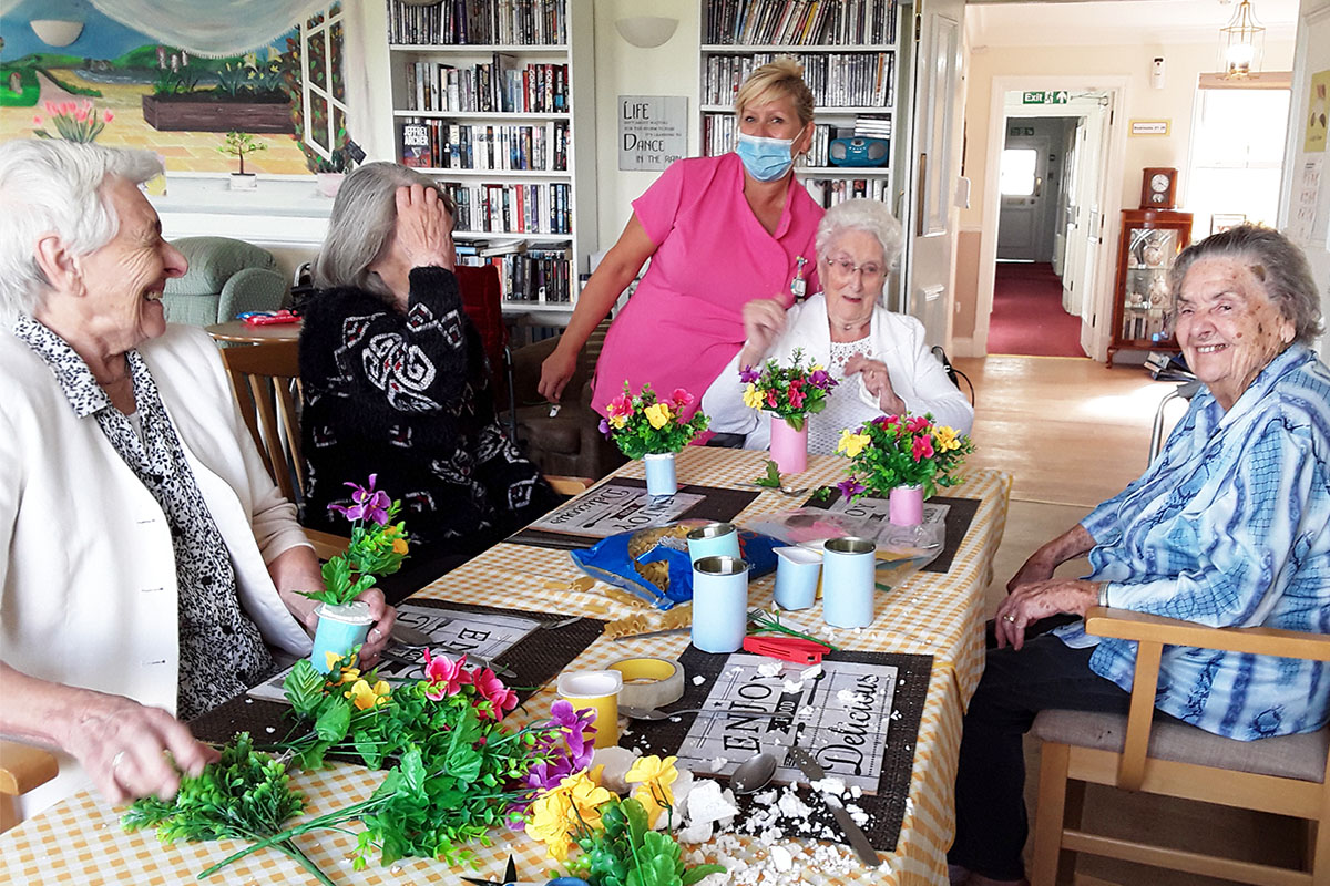 Silverpoint Court ladies doing flower arranging around a table