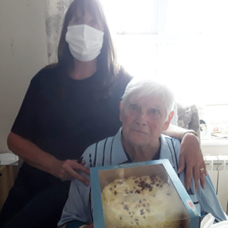 Silverpoint Court Residential Care Home resident with his chocolate birthday cake