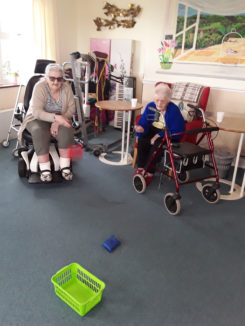 Residents playing bean bag target at Silverpoint Court Residential Care Home