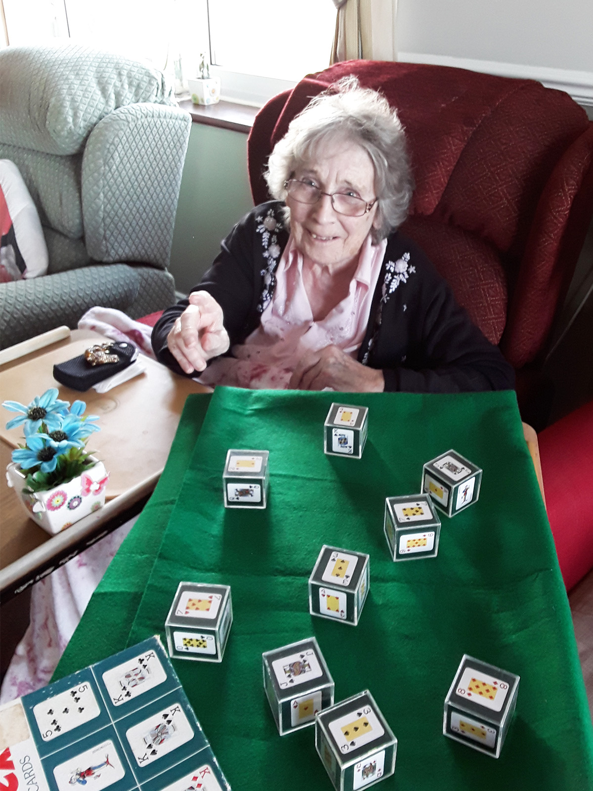 Resident enjoying a game of cube pontoon at Silverpoint Court Residential Care Home