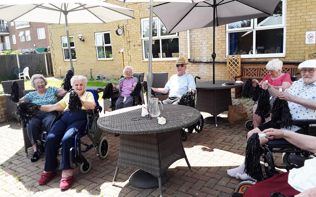 Sunflowers and gentle exercise in the garden at Silverpoint Court Residential Care Home