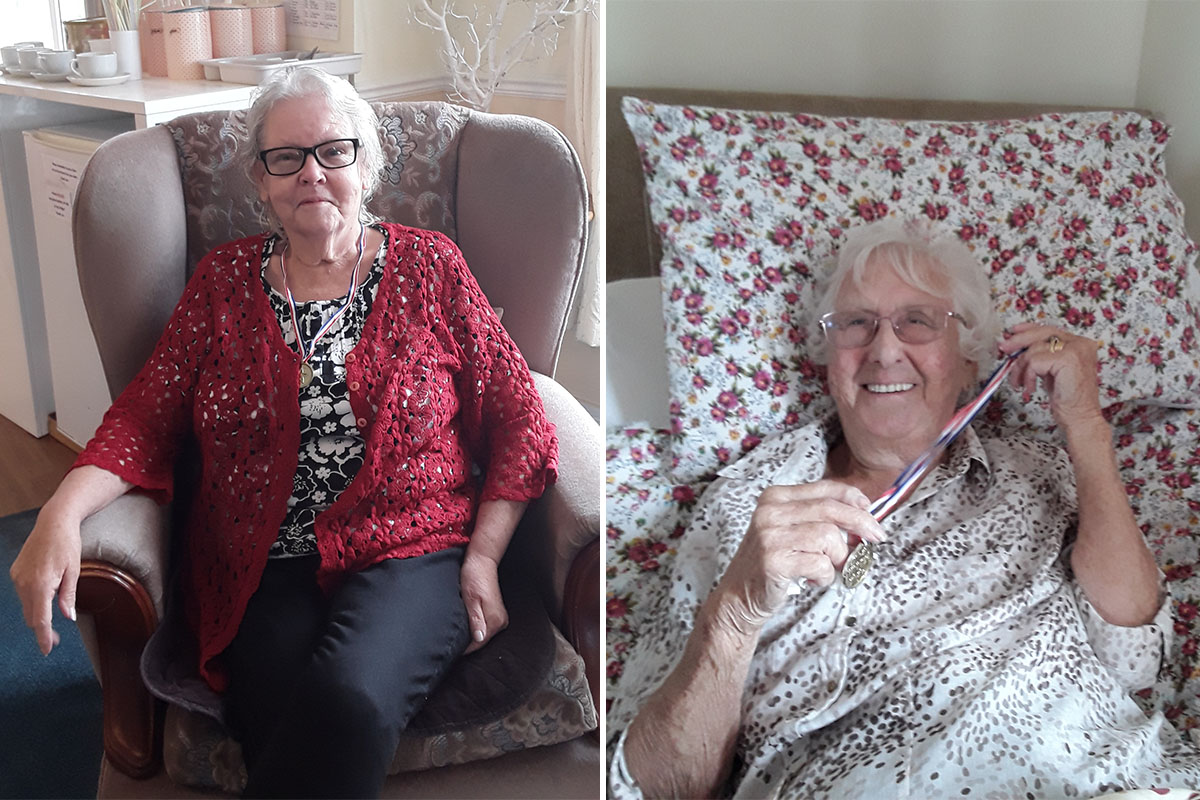 Two ladies with their Boccia medals at Silverpoint Court Residential Care Home