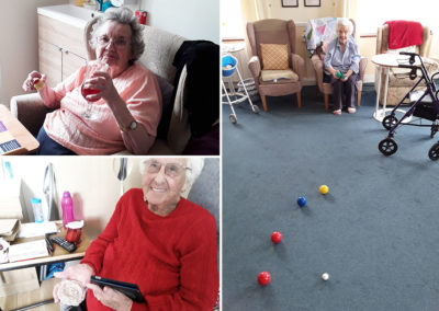 Resident drinking sangria, lady playing Botcha and resident showing off her crocheted place mat at Silverpoint Court