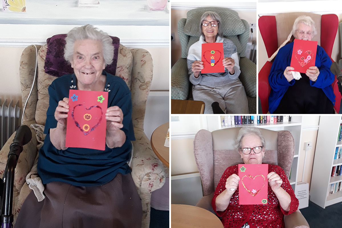 Ladies showing off their handmade Valentine cards at Silverpoint Court Residential Care Home