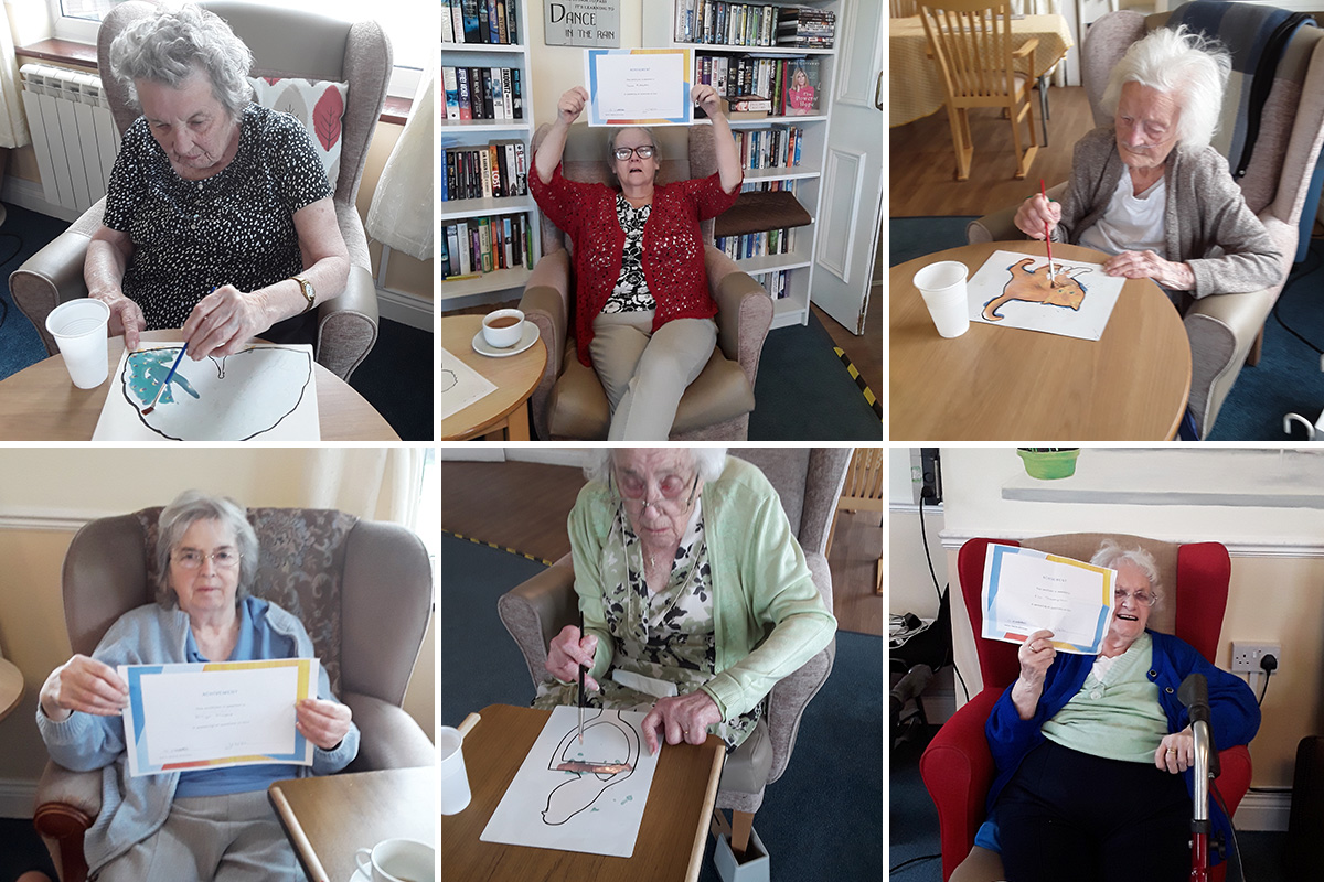 Silverpoint Court Residential Care Home residents enjoying magic painting and their quiz certificates