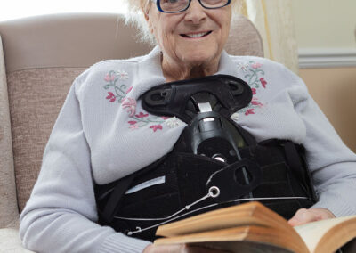 One of our ladies reading in the Lounge at Silverpoint Court