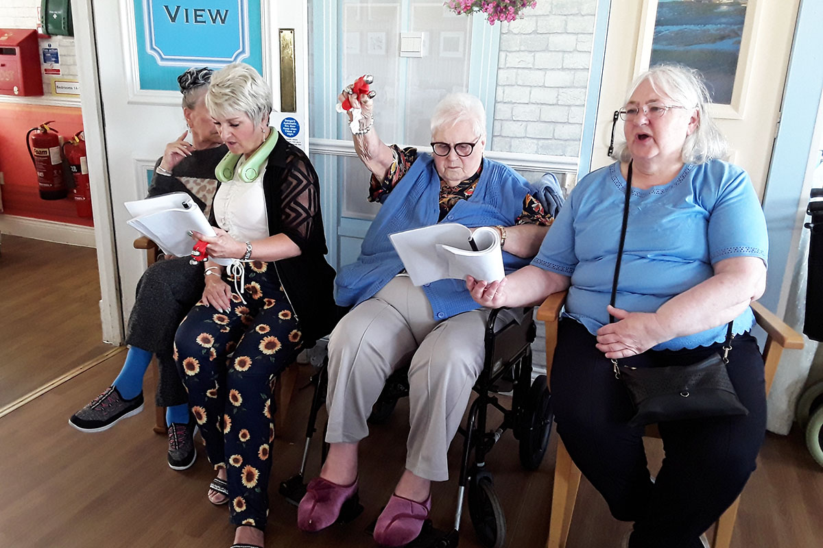 Silverpoint Court Residential Care Home residents enjoying singing hymns together